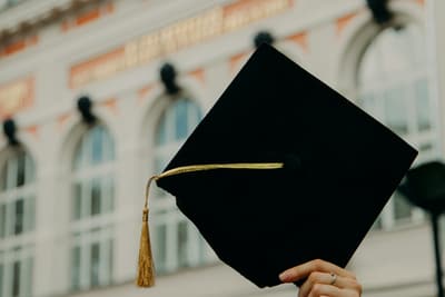 A Codinzy student holding their course certificate